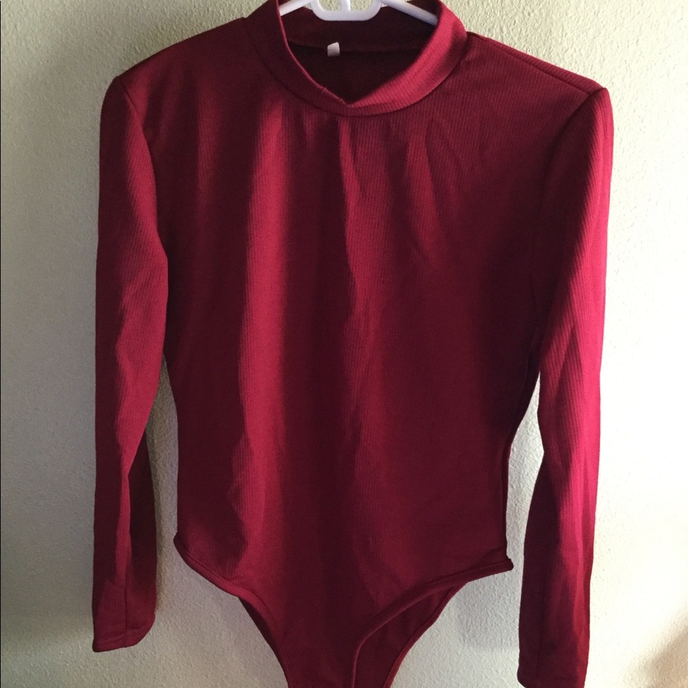 Red bodysuit with gold sleeve buttons